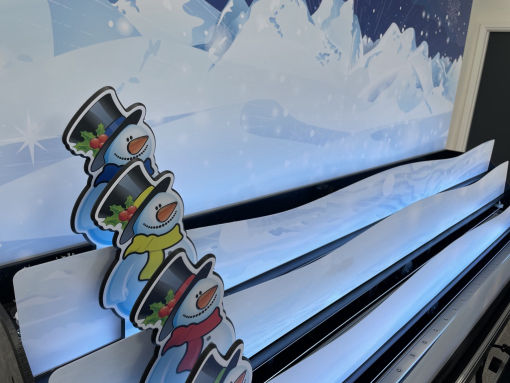 Snowman roll a ball derby game for roll and bowl systems