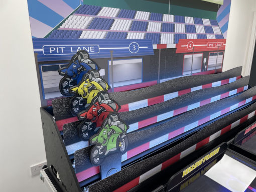 Motor bike roll a ball derby game for roll and bowl systems