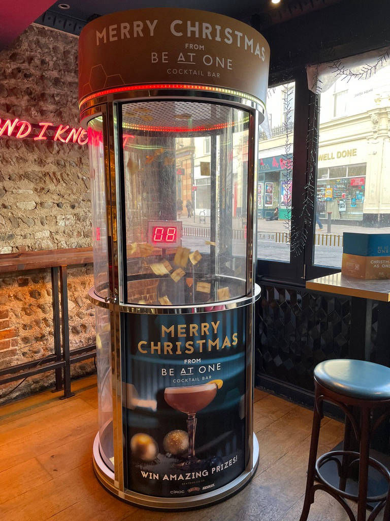 Cocktail bar ball grabber game